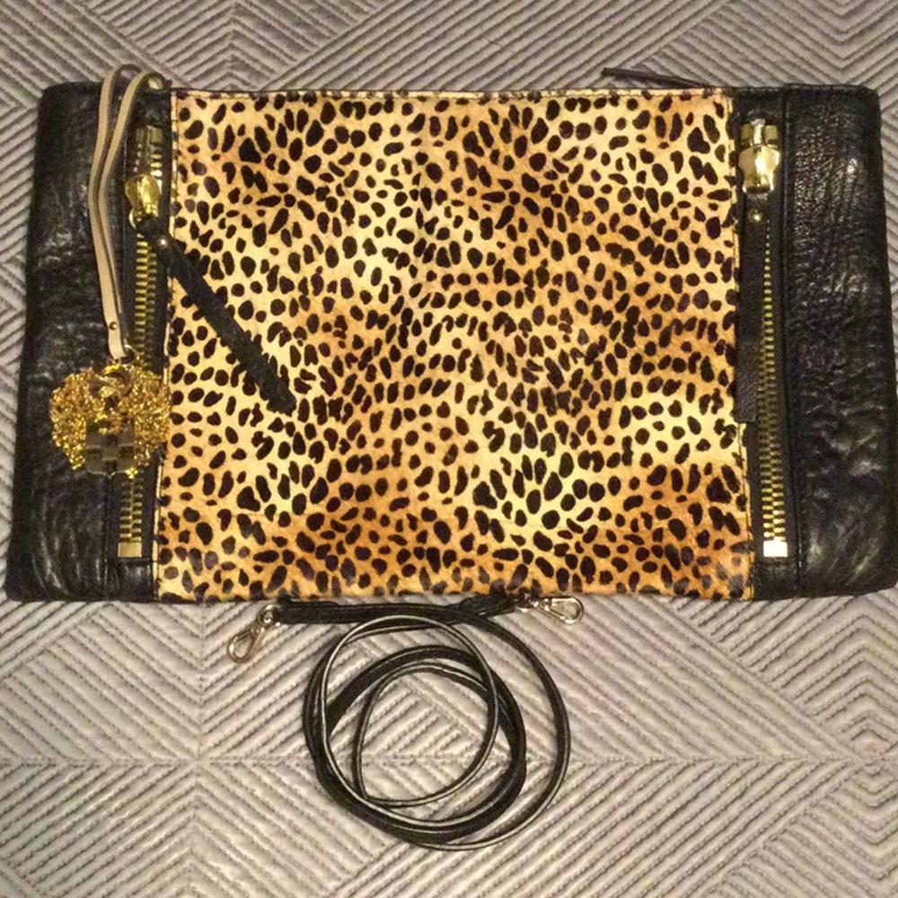 Vince Camuto black pebbble leather and leopard print horse hair hide handbag.